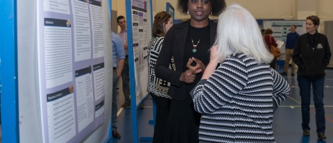 Student researcher Amanda Anderson explains her poster.