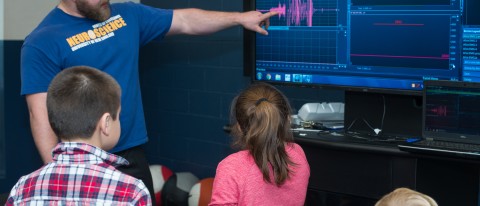 UNE's Mike Lawrence leads an exhibit at the Brain Fair