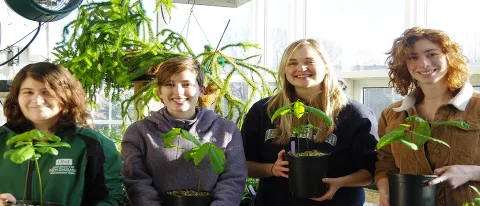 Seniors in UNE’s Department of Environmental Studies Sarah Fleishmann, Kati Hein, Christina Barton and Kat Santarpio with hybrid