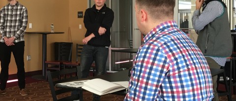 Students in the Sport Marketing course present their promotion plan for a Maine Mariners "College Fight Night" to Adam Goldberg