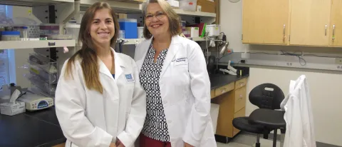 University of Granada graduate María Caamaño Sanchez with UNE's Associate Provost of Research and Scholarship Karen Houseknecht