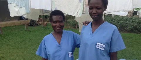 Health workers in Uganda wear scrubs donate by UNE medical students