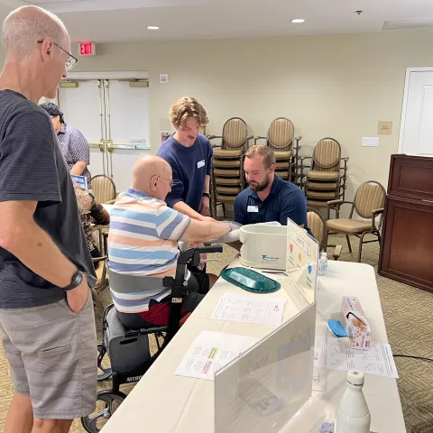 UNE occupational therapy students assist older adults at a wellness fair